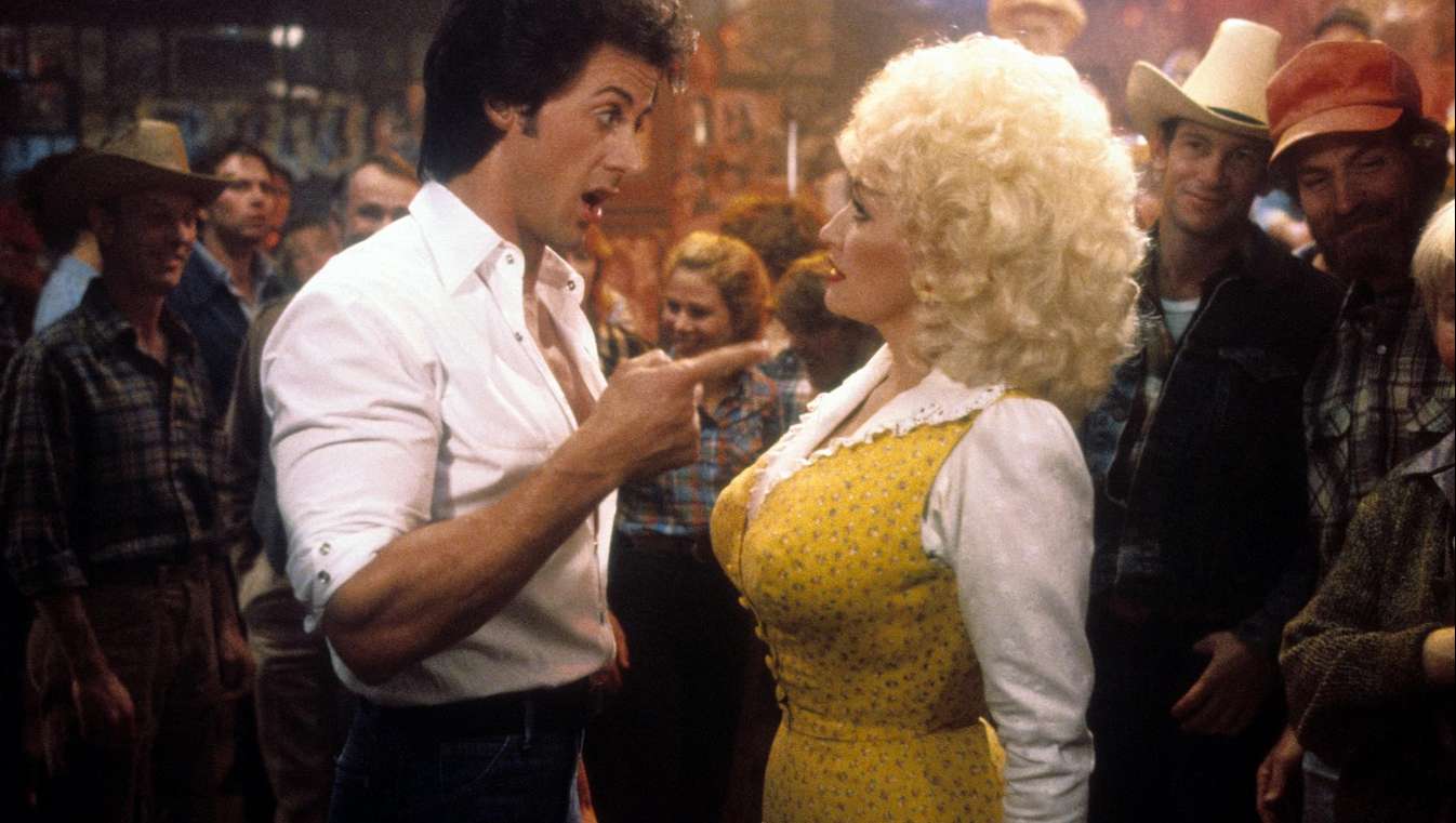 Sylvester Stallone and Dolly Parton in Rhinestone.